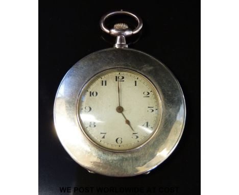 A slender 9ct gold pocket watch with Arabic numerals, keyless wind movement, engine turned face and broad bezel, case diamete
