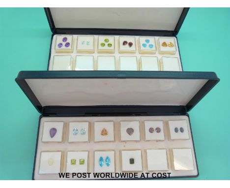 A quantity of gemstones to include amethyst, aquamarine, citrine, garnet, opal, blue topaz etc with certificates 