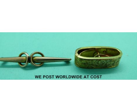 A yellow metal scarf clip with chased floral decoration and a yellow metal brooch marked 9ct gold (5.3g)