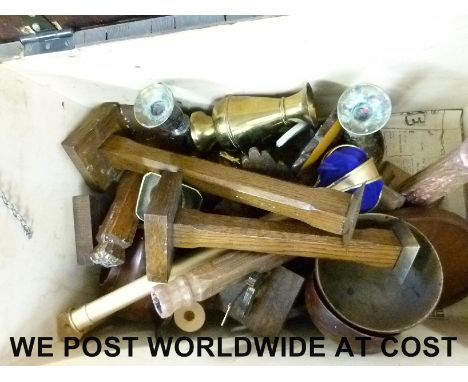 A quantity of wooden brass items in a trunk including candlesticks, bowls etc