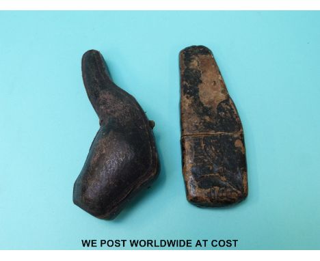 A Meerschaum pipe in the form of a hand in a hat, and a pocket set of fleams or blood letting tools