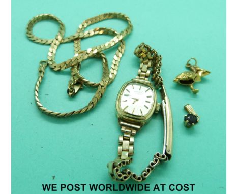 A yellow metal necklace marked 375 (14.4g), a 9ct gold Rotary watch, a 9ct gold charm in the form of a stork and a small 9ct 