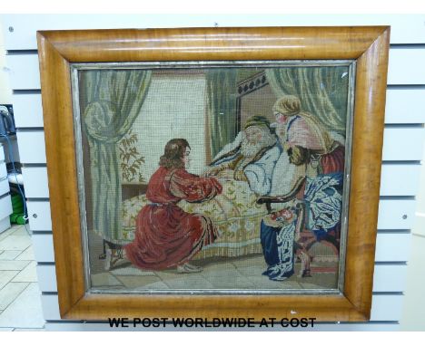 A large 19thC tapestry of an old gentleman in bed being visited/cared for by a young couple, in  satinwood cushion frame