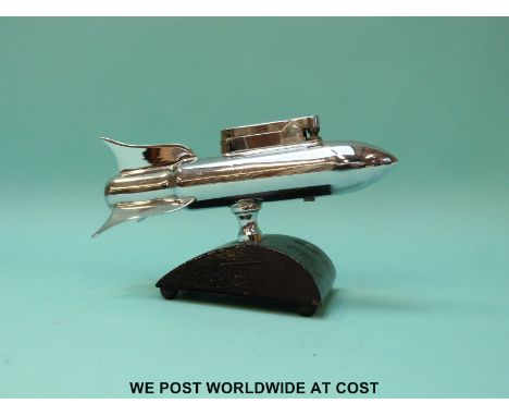 A vintage table lighter in the form of a rocket, length 15.5cm