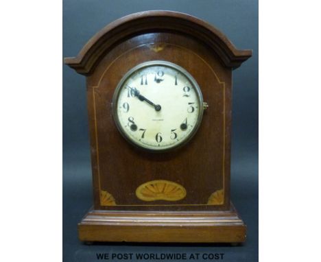 A mahogany cased mantel clock by Gilbert, made in Winsted, Conn, USA, the ivory coloured dial with Arabic numerals and black 