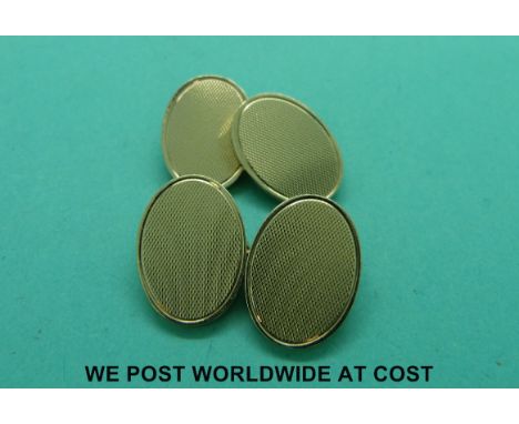 A pair of 9ct gold cufflinks with engine turned decoration (15.9g)