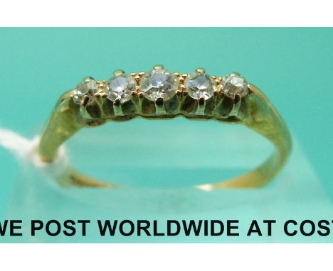 An 18ct gold ring set with five old cut diamonds (size M)