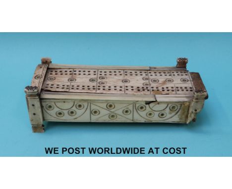 A Napoleonic prisoner of war bone cribbage box and domino set, length 15cm
