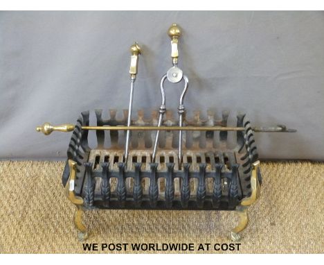 A small fire basket and fire tools (width 48cm)