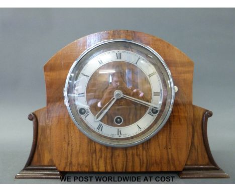 A 1930s three train walnut cased mantel clock, British made movement no. 121014, Roman numerals on metal chapter ring and sci