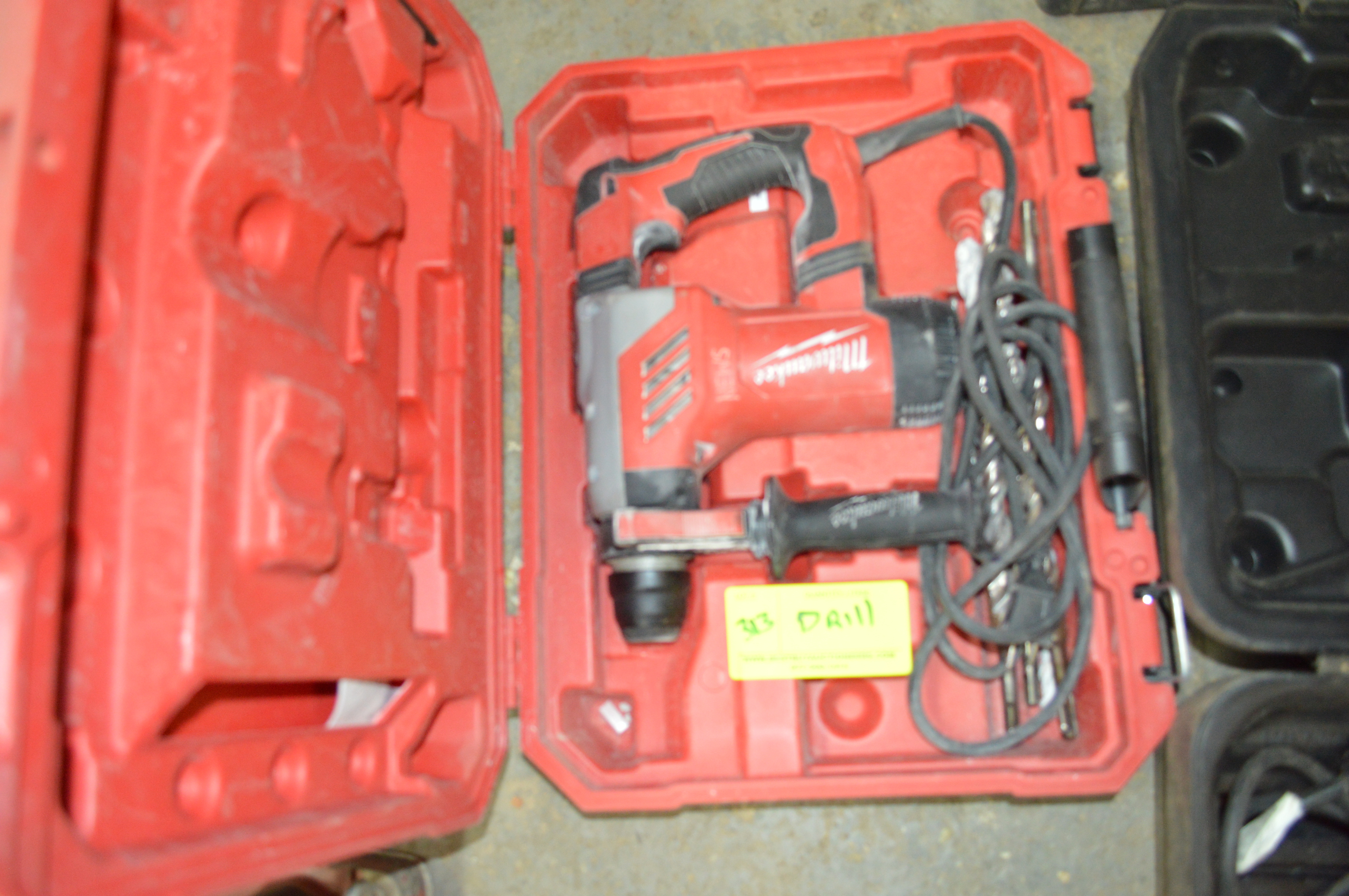 MILWAUKEE HAMMER DRILL AND CASE WITH 5 BITS INCLUDED