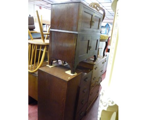 Compact oak tallboy and a two over two door mahogany side cabinet