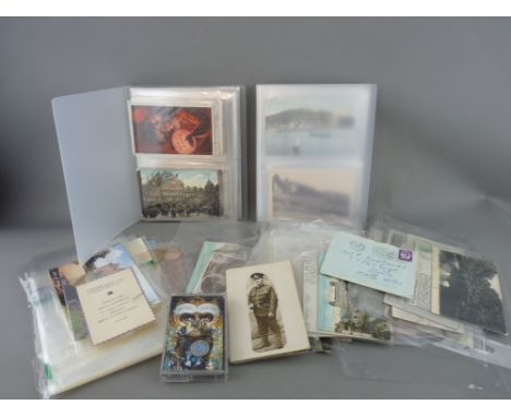 Collection of vintage postcards and ephemera including street scenes with motor vehicles and trams along with a Michael Jacks