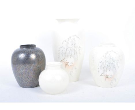 An assortment of four vintage 20th century Poole Pottery Delphis lustre glaze ceramic vases. The lot comprising of an ash col