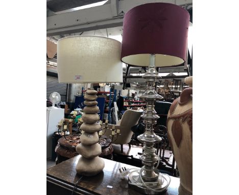 A contemporary stacked pebble style table lamp and another modern table lamp. 