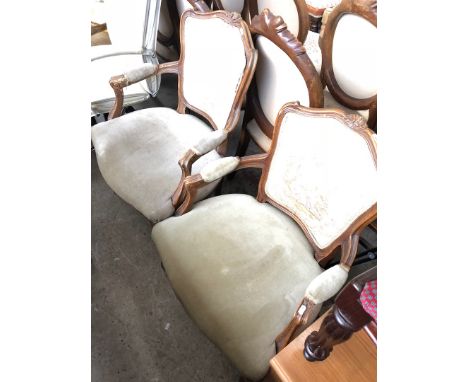 A pair of reproduction tapestry upholstered armchairs. 