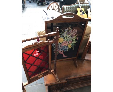 A stained glass fire screen and a needlework firescreen. 