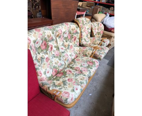 An Ercol two piece blonde suite and another non matching chair. 