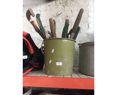 A bucket containing tools 