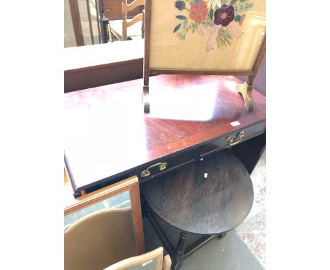 A sofa table with and small round table. 