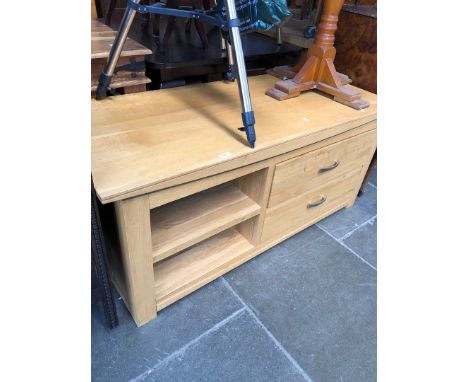 A light oak TV cabinet. 