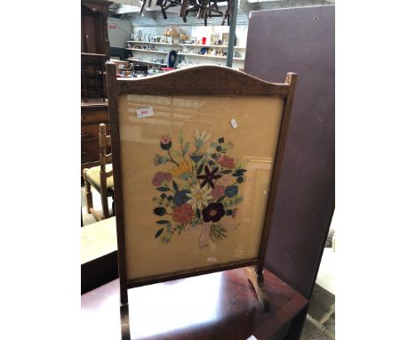 A tapestry firescreen. 