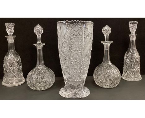 A pair of late 19th / early 20th century cut glass globe decanters, 31.5cm high;  another pair of cut glass bell shaped decan