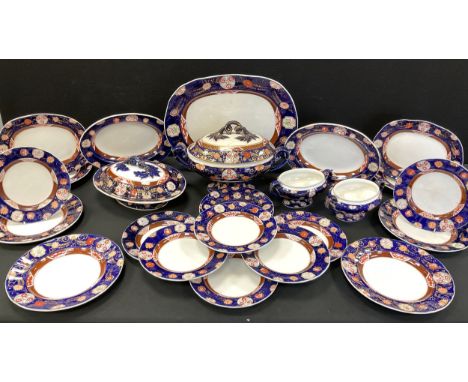 Real Ironstone dinner service, decorated with floral patterned print on colbalt blue border comprised of; a meat dish, six di