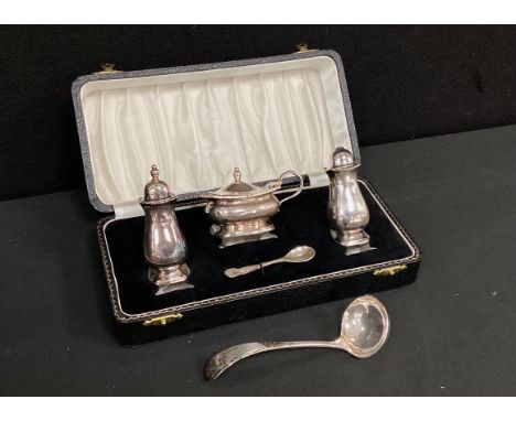 A Silver cruet set including; mustard pot, spoon, salt and pepper shaker, conforming sauce spoon, Birmingham, 167.12 grams.