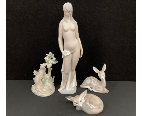 Lladro - A Lladro figure of a nude lady, standing with a draped towel at her waist, printed and impressed marks to base, 46cm