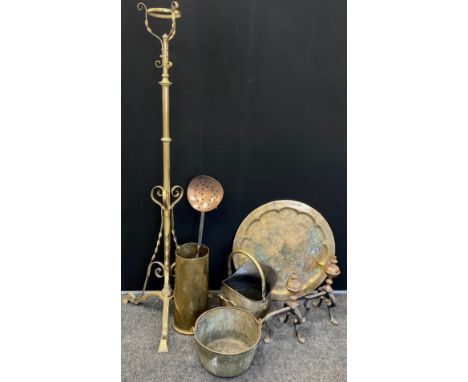 Brass and copper - a wrought brass floor standing oil lamp, a pair of 19th century fire dogs; a large artillery shell;  coal 