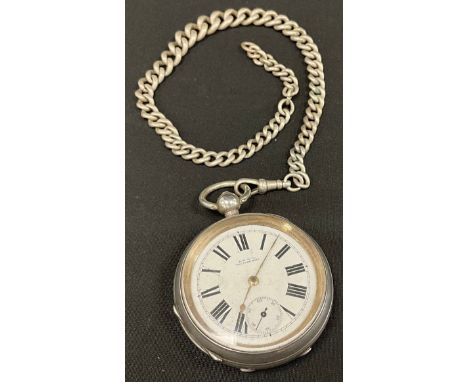 A Victorian silver Waltham pocket watch and Albert Chain, bold Roman numerals, key wind movement, 53mm diameter silver case, 
