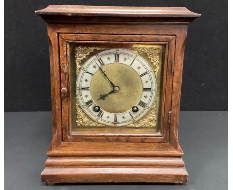 A Winterhalder &amp; Hoffmeier oak cased chiming bracket clock, the brass face with silvered dial and black Roman numerals, 2
