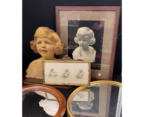 A 1920s cut-out bust print of a young Girl, the reverse marked Edward Cox, Margate, 40 cm high, similar hand embellished phot