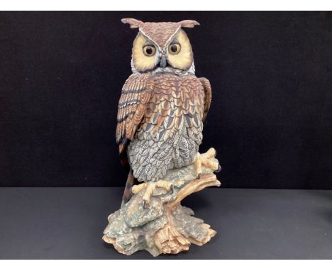A large Capodimonte ceramic model of an Eagle Owl, marks to base, inscribed V. Bindi, 55cm high.