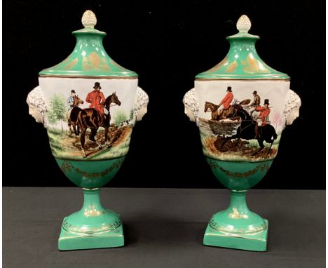 A pair of green hunting scene lidded urns, gilded detail, faux Sevres mark, 30cm (2).