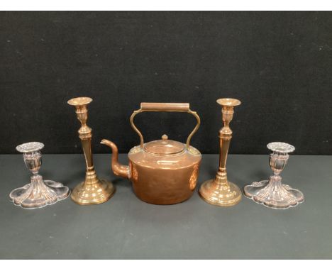 A pair of 19th century copper candlesticks, 26.5cm high;  a pair of silver plate on copper candlesticks;  a 19th century copp