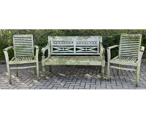 A garden bench with floral carvings to back rest, rolled legs, 90cm high, 129cm wide, 49cm seat depth; a pair of “A W Robinso