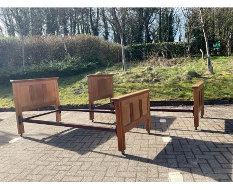 A pair of mid century light oak single bed frames, height 97cm, width 98cm, depth 204cm (2).