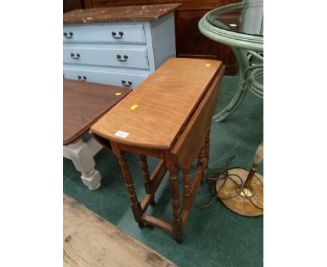 A small oak drop leaf table with gate leg 