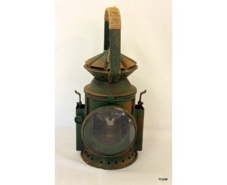 A WW2 handheld railway signal lamp in full working order made by Wakefields of Birmingham in 1945 with the War Department bro