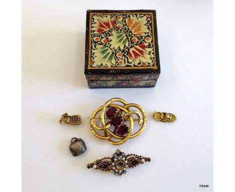 An Amethyst brooch and charms  and turquoise and pearl brooch