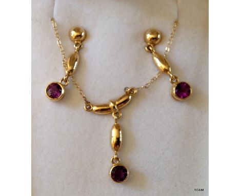 A 9ct Gold Hallmarked Amethyst necklace and earring set 