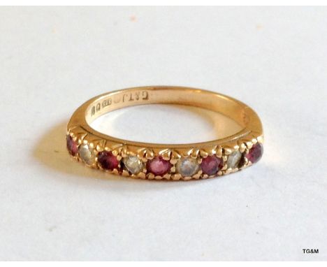 A 9ct gold ruby and Sapphire 1/2 etertnity ring size N