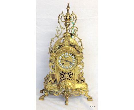 A French brass mantle clock with key and pendulum 47 x 26 x 14