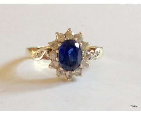 A 9ct gold sapphire cluster ring size Q