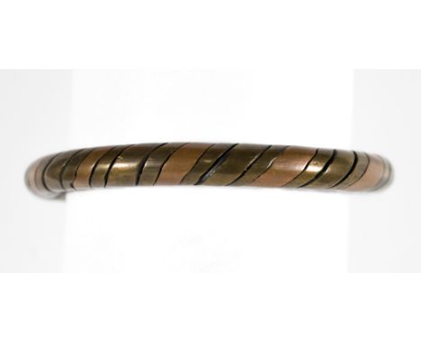 ROMAN COPPER AND BRONZE BRACELET, 100 A.D. Roman bi-colored copper and bronze bracelet, very sturdy and created from twisted 