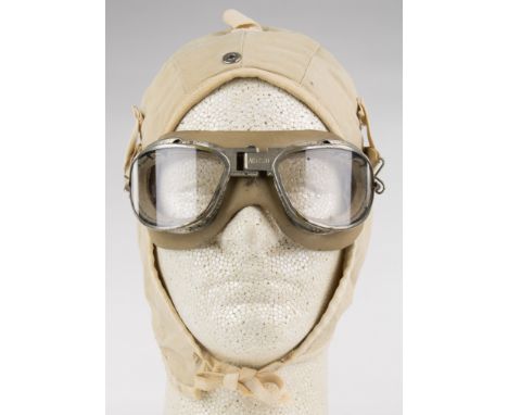 AMERICAN MILITARY PILOT'S GOGGLES AND CAP Pair of items includes World War II U.S. Army and Navy-used AN 6530 flight goggles,