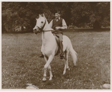 MONTGOMERY ON ROMMEL'S HORSE A great original war-date photograph showing Field Marshal Bernard L. Montgomery atop the favori