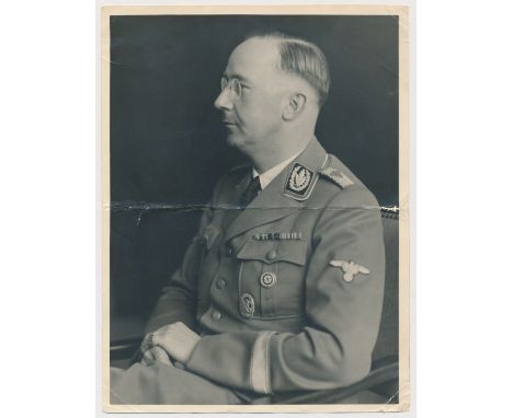 PHOTO OF HEINRICH HIMMLER TAKEN FROM HIS OWN DESK Original, fine seated portrait of HEINRICH HIMMLER (1900-1945), taken from 